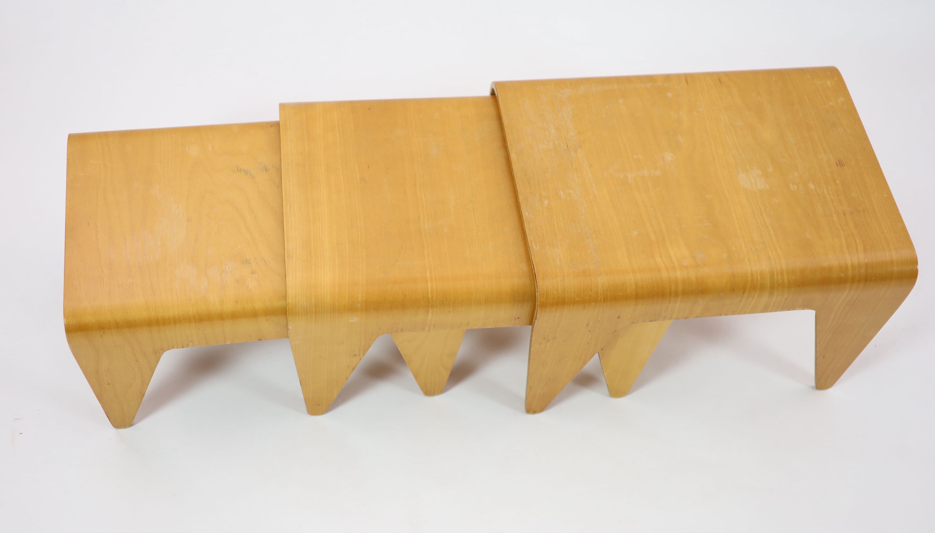 Marcel Breuer (Hungarian 1901-1981) probably by Isokon, a nest of three bent ply birch laminate tables, H 38cm. W 61cm. D 46cm.